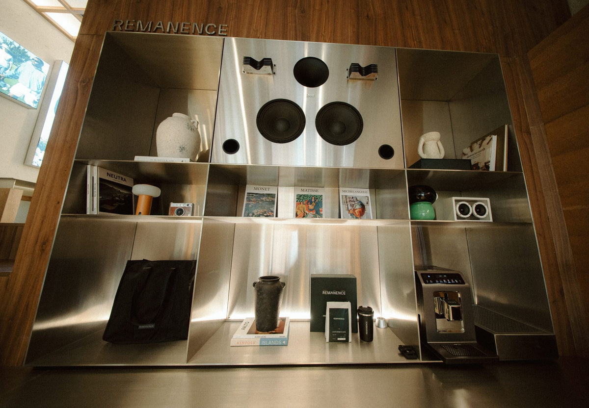 The steel wall of the store with the collection on display