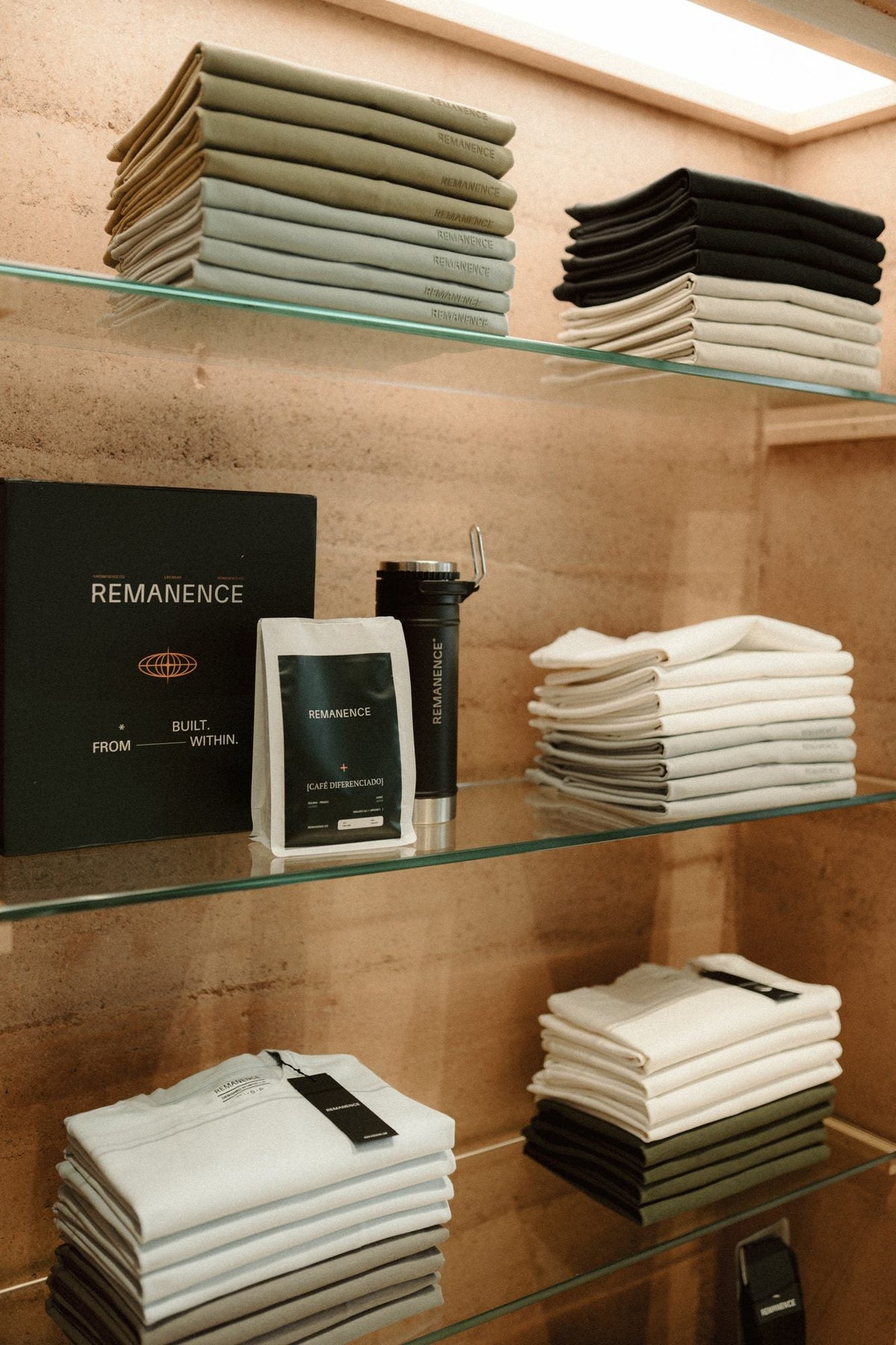 Folded t-shirts on the wooden shelf