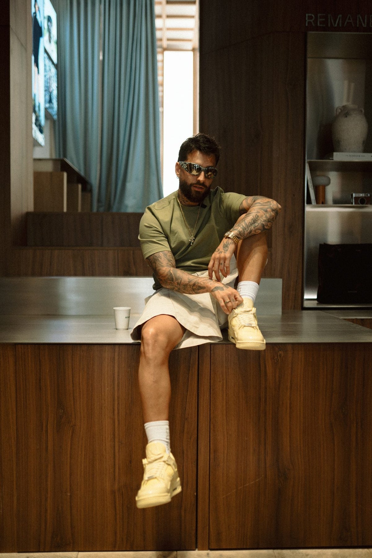 Juan Luis sitting at the store counter