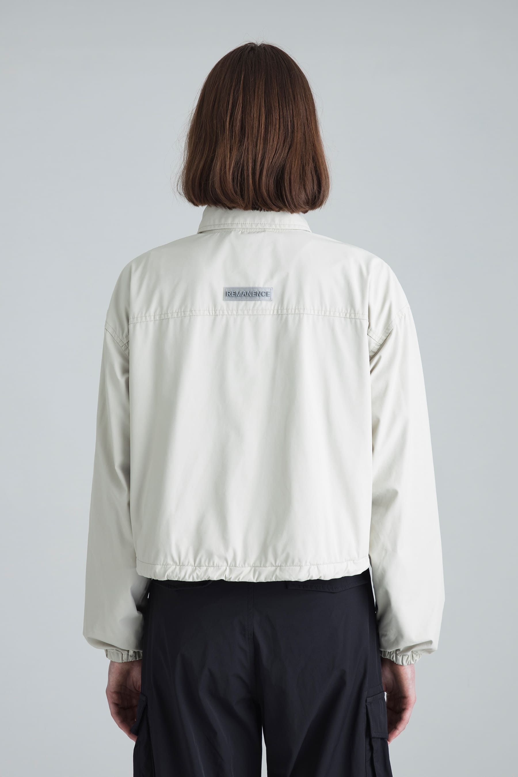 Women's sand jacket boxyfit Relay back view on model