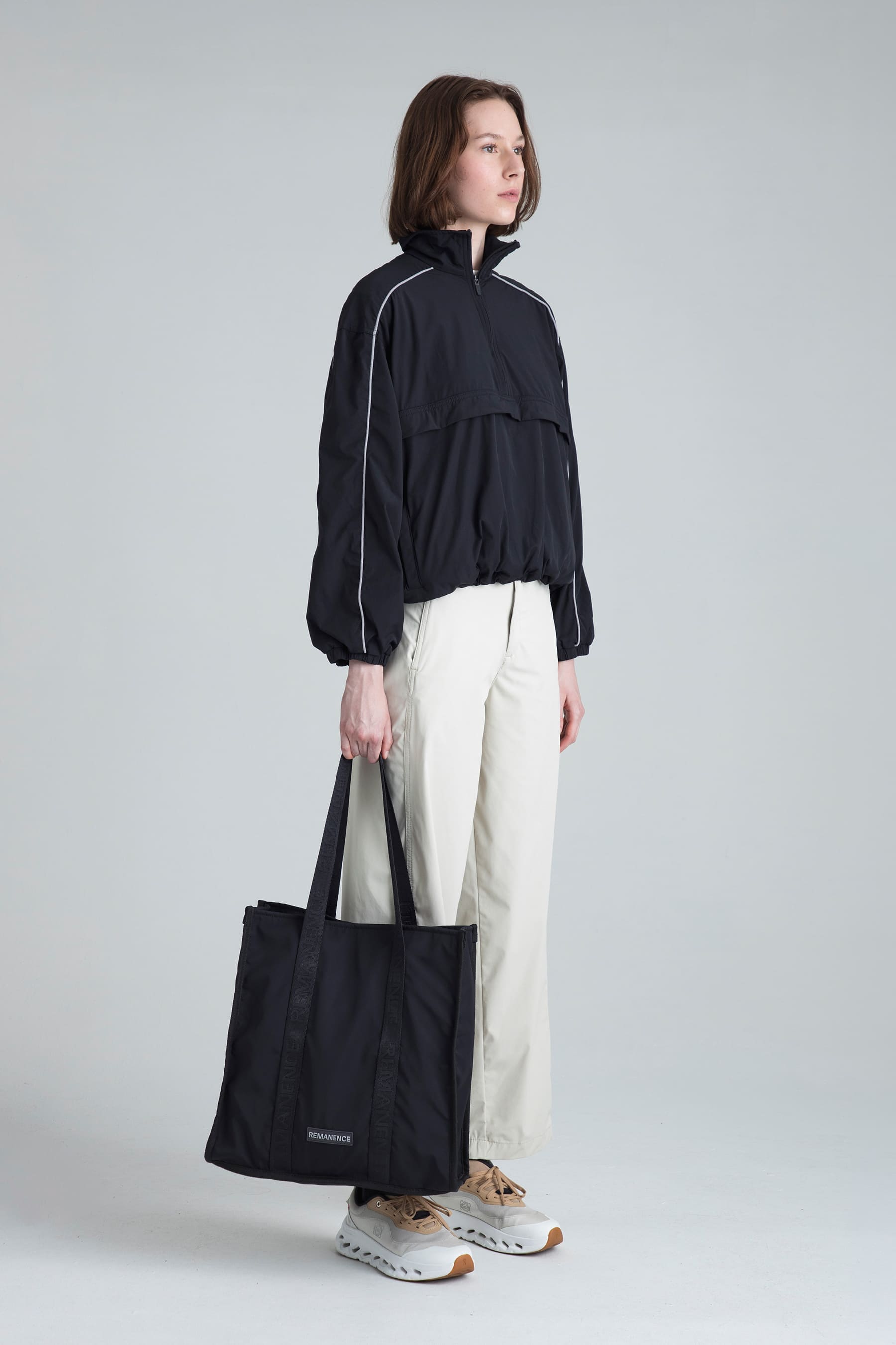 Women's black jacket Shade styled casually with tote bag