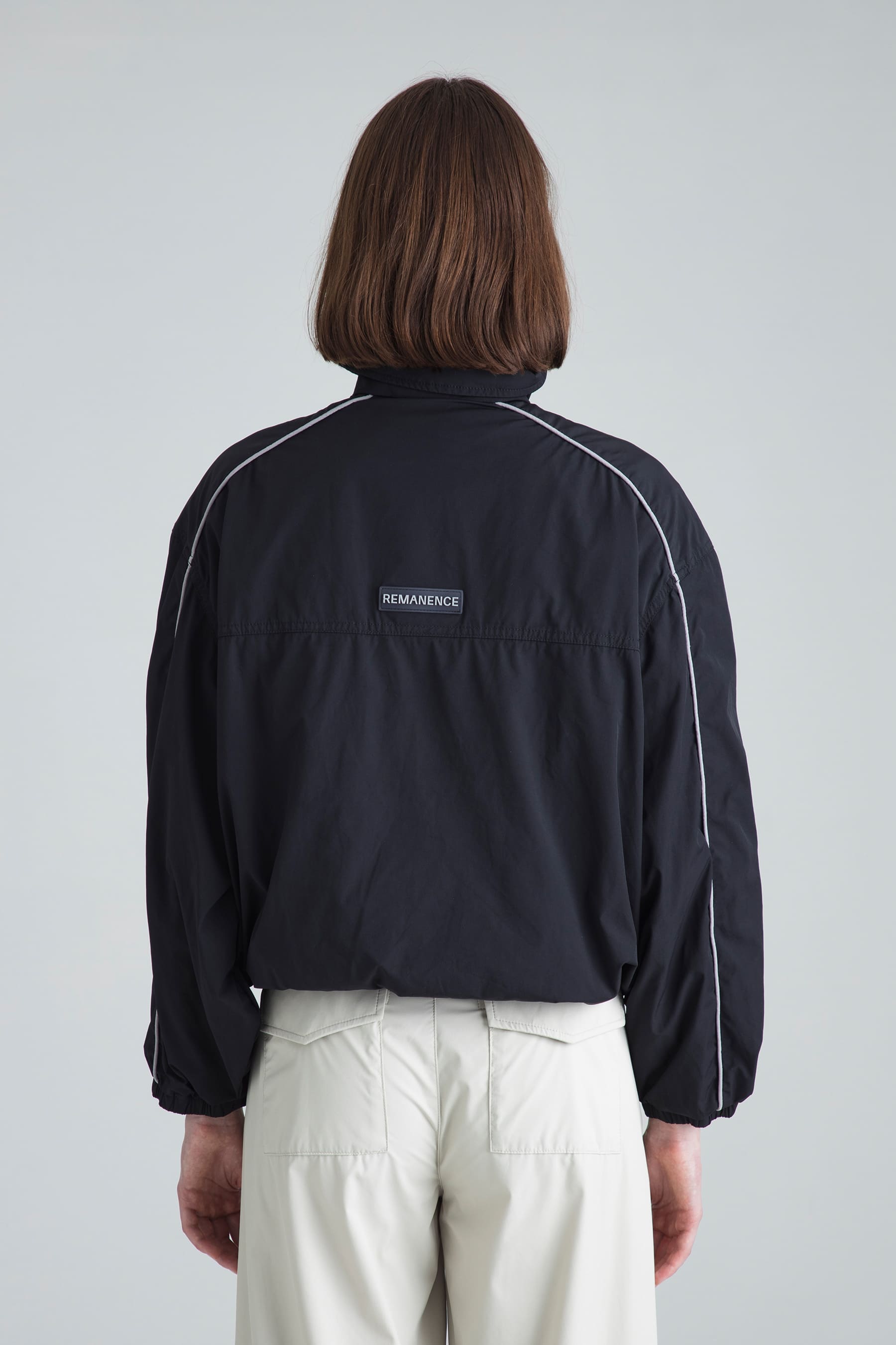 Women's black jacket Shade back view on model