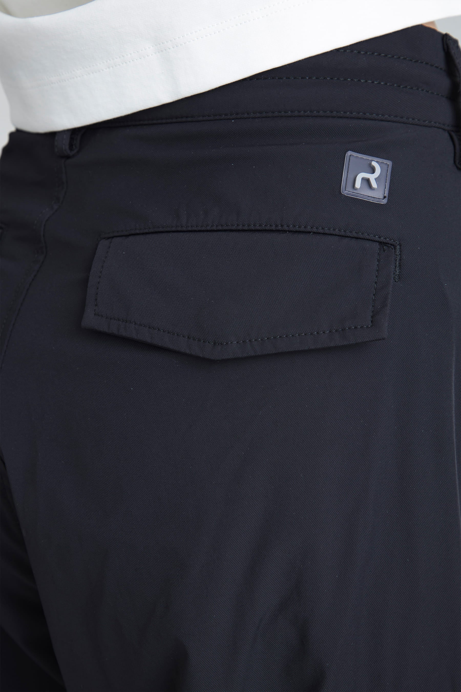 Back pocket detail and logo on Women's black parachute pants