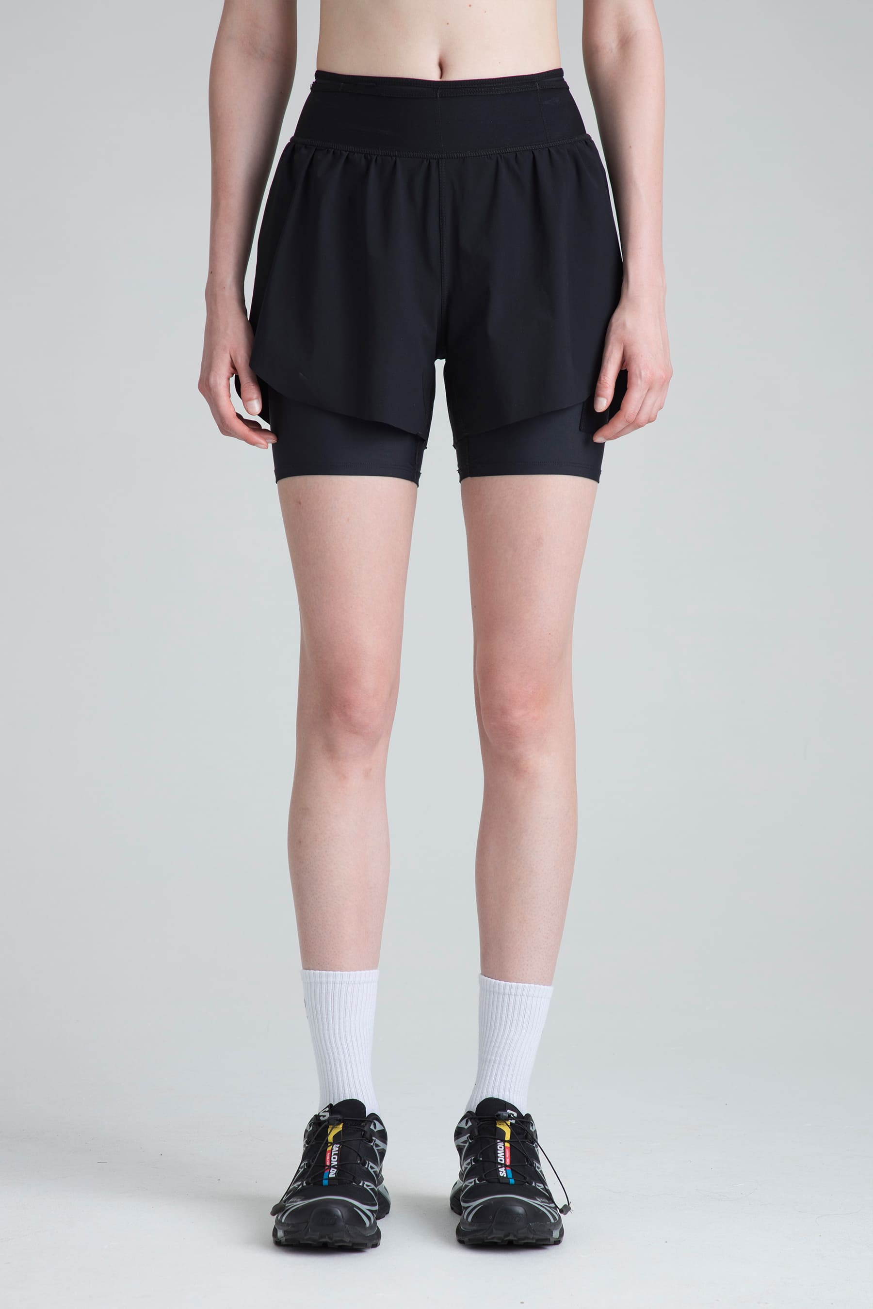 Women's black sports shorts Span front view on model