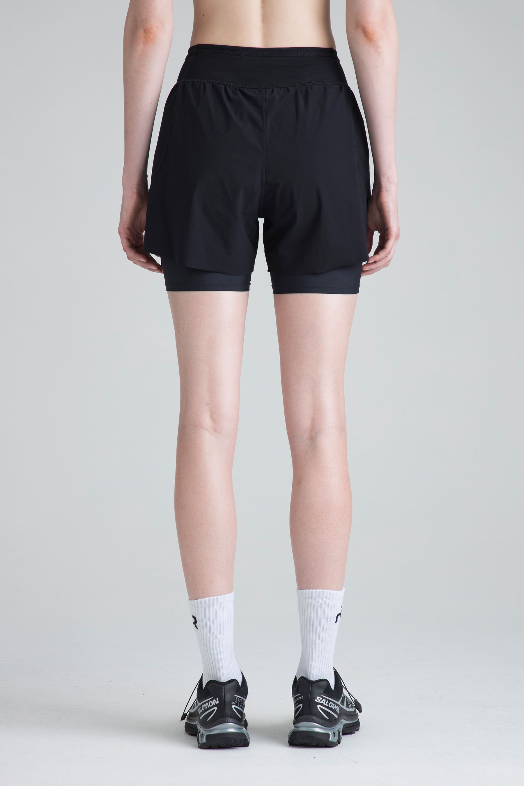 Women's black sports shorts Span back view on model