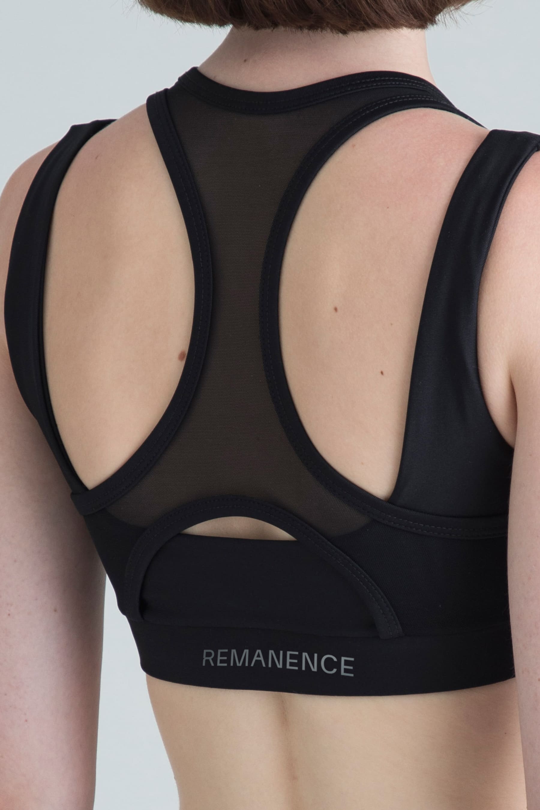 Women's black sports top Apex — detail of athletic mesh back