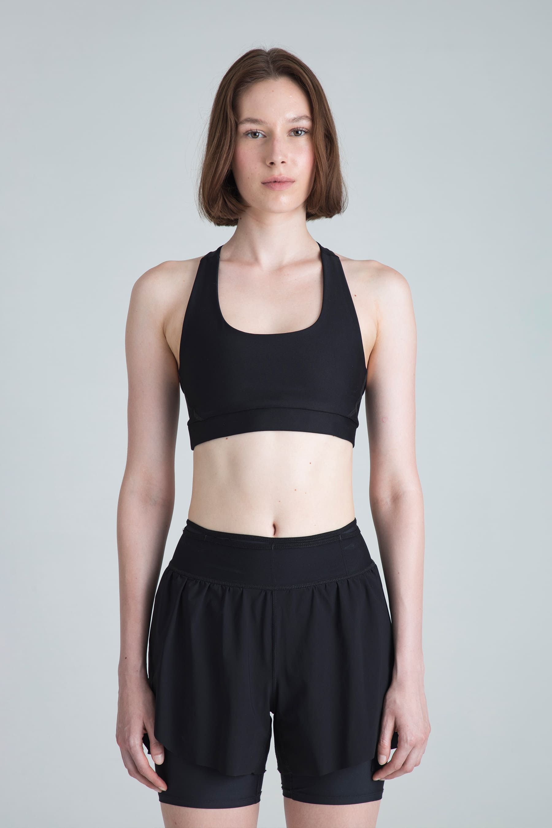 Women's black sports top Motion medium support on model
