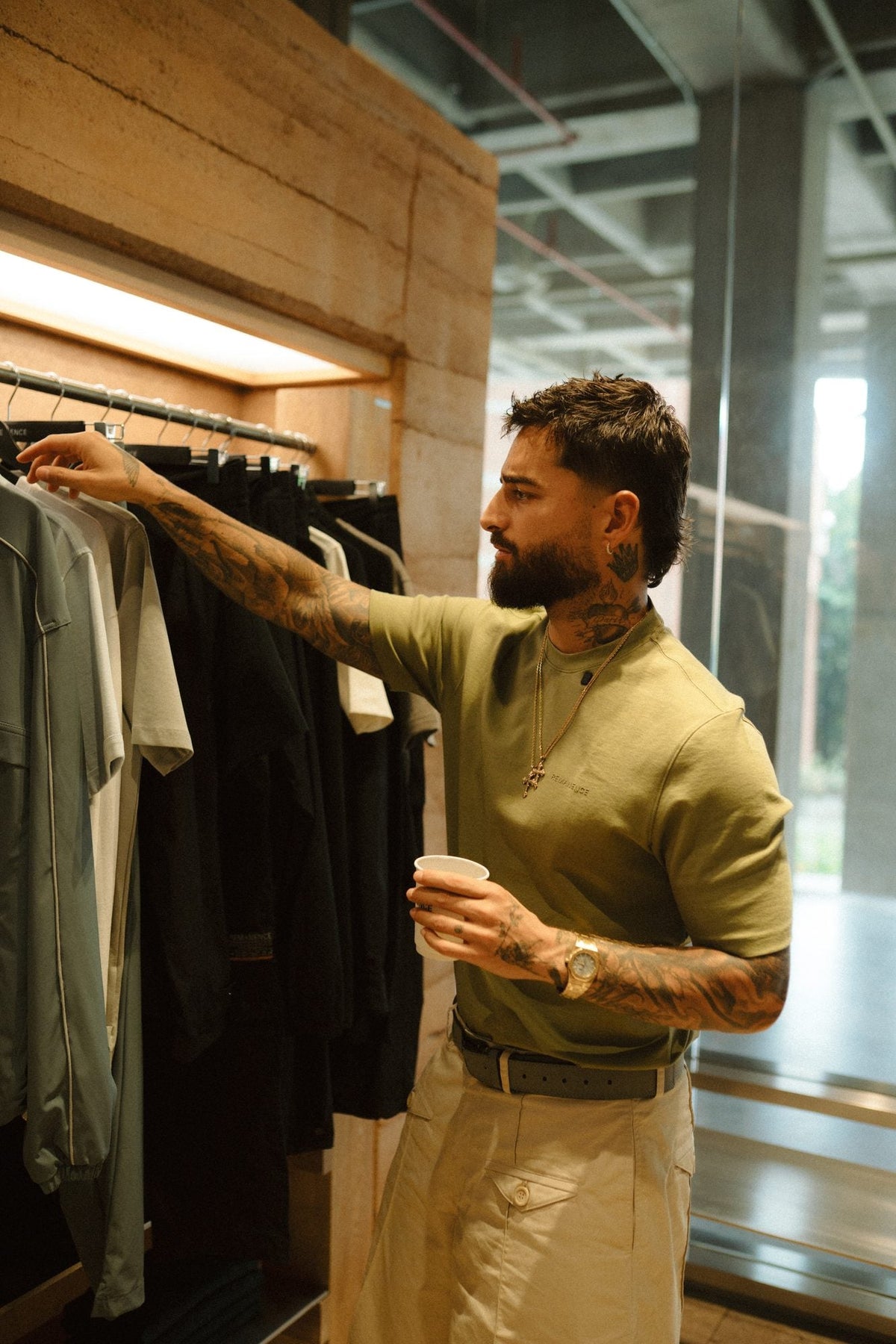 Juan Luis picking clothes in the store
