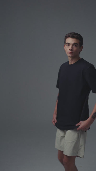 Video showing fit and details of Men's black t-shirt Cling